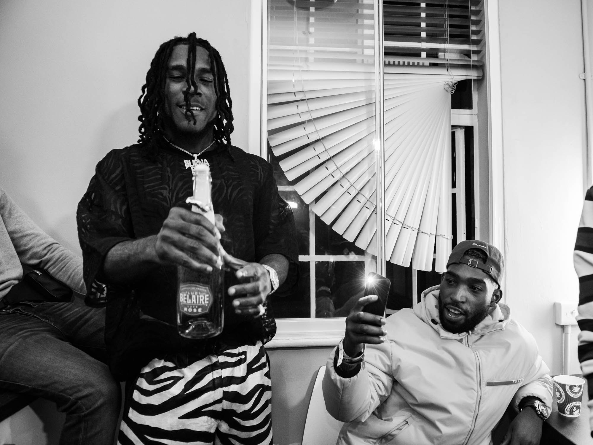 London, United Kingdom. 7th October 2018.  Dressing Room : Burna Boy celebrating his successful concert with Tinie Tempah.  Photographed by Michael Tubes