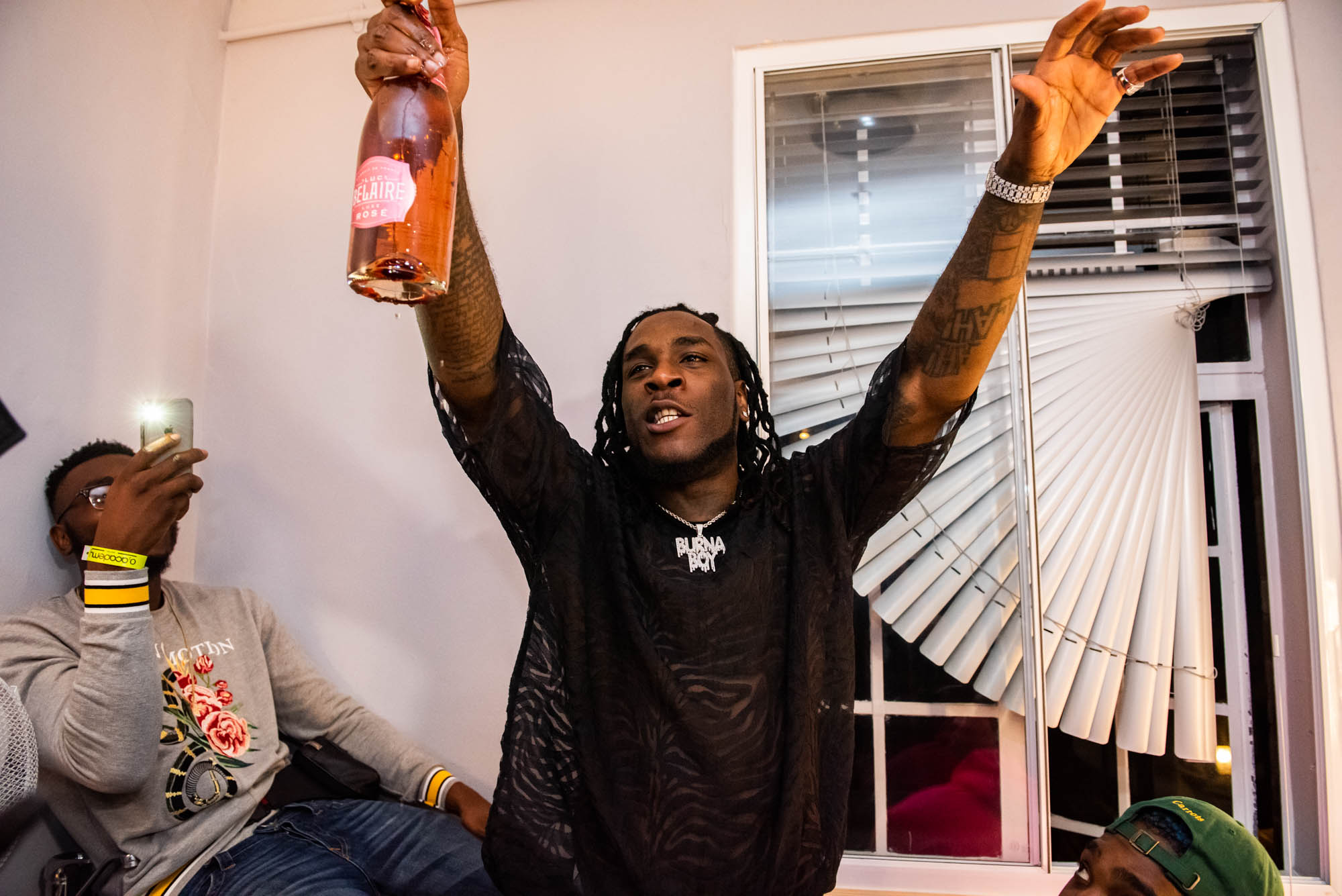 London, United Kingdom. 7th October 2018.  Dressing Room : Burna Boy celebrating his successful concert with Tinie Tempah.  Photographed by Michael Tubes